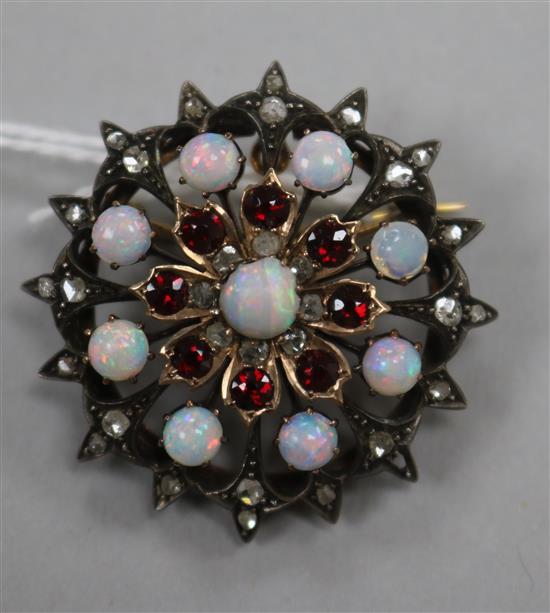 A Victorian white and yellow metal, white opal, garnet and rose cut diamond set pendant brooch, 33mm.